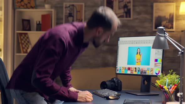 Young Creative Photographer Working on a Photo on Computer