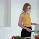 Young Woman Slicing Cucumber For Vegetable Salad. White Modern Kitchen. - VideoHive Item for Sale