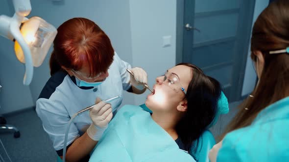 Young woman visits stomatology cabinet