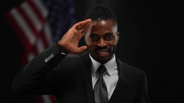 Portrait of Positive Confident African American Man in Suit Talking Saluting Gesturing and Looking