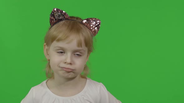 Girl in Headband with a Cat Ears Shows Emotion of Dissatisfied