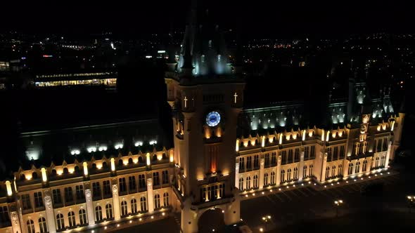 Aerial drone view of lighted Culture Palace at night. Iasi, Romania