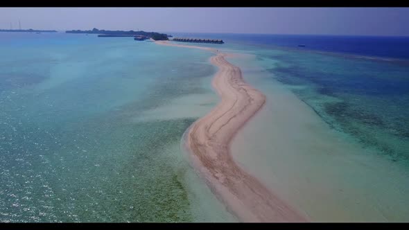 Aerial abstract of exotic sea view beach wildlife by blue water and white sandy background of a picn