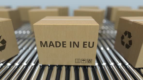 Boxes with MADE IN EU Text on Roller Conveyor