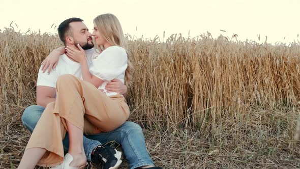 Young Beautiful Couple in a Wheat Field