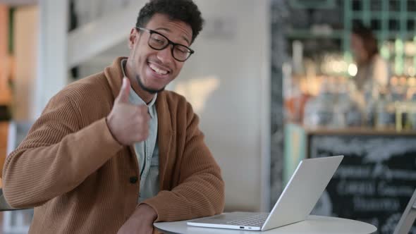 Thumbs Up By African Man Laptop Cafe