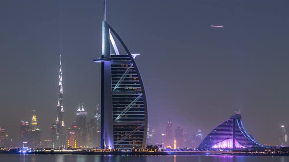 Skyline of Dubai By Night with Burj Al Arab From the Palm Jumeirah Timelapse