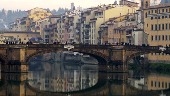 Panorama of Ponte Santa Trinita Bridge Over Arno River in Florence, Italy in the Morning. Panning