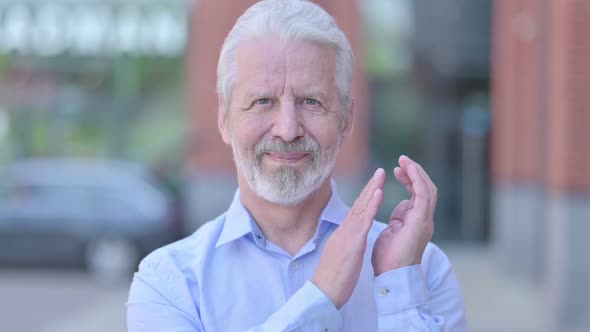 Outdoor Old Man Clapping with Hands