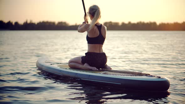 Girl Stand Up Paddle Boarding. Warm Summer Beach Vacation Holiday. Travel Paddles Paddleboard.