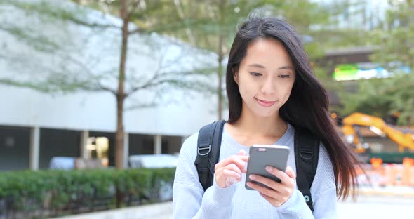 Woman use of smart phone in the city