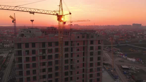 Construction Site in the Middle of the City and Private Houses at Sunset in .