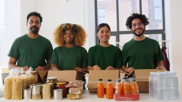 Volunteers with Food Donation Showing Thumbs Up