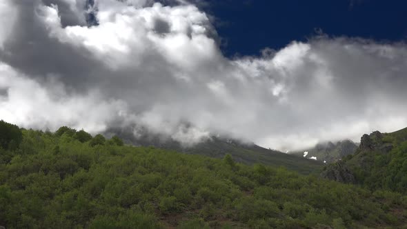 Spectacular Cloud View Over The Forested Mountain Ridge