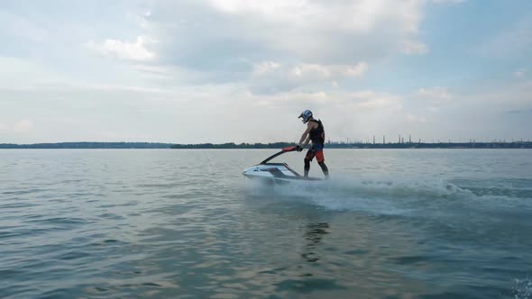 Man drive in jet ski, boat. Еxtreme summer sport. Activity leisure on sea.