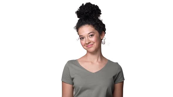 Portrait of Content Shy Woman Wearing Basic Tshirt Nodding and Accept Proposal with Smile Isolated