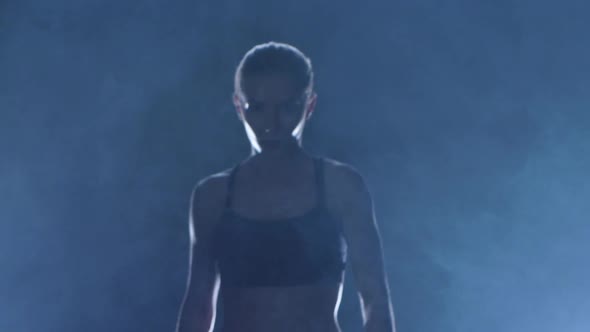 Coming Out Woman Boxer Which Has Muscular Body. Slow Motion