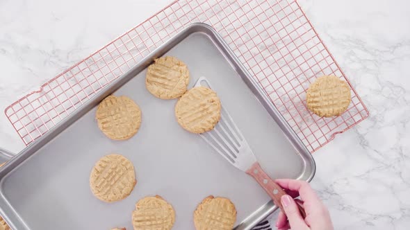 Time lapse. Flat lay. Step by step. Freshly baked peanut butter cookies on baking sheet.