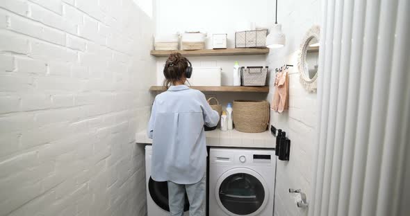 Woman Washing Clothes at Home