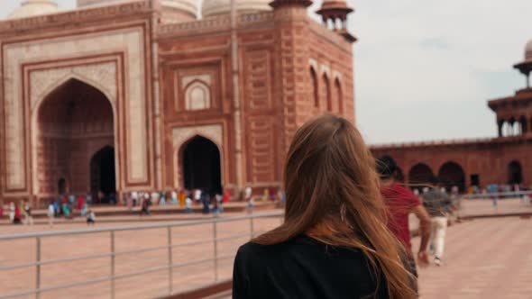 Tourist Woman Backview Walking in India Taj Mahal