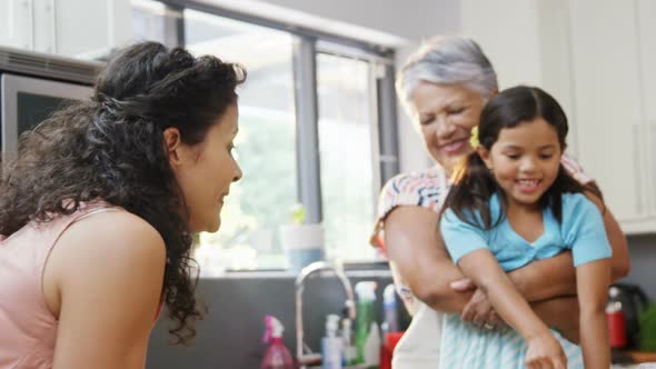 Mother, daughter and granny having fun in the kitchen 4K 4k