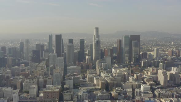 AERIAL: Breathtaking Wide Shot of Downtown Los Angeles, California Skyline in Beautiful Sunlight