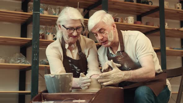 Happy Seniors Woman and Man During Pottery