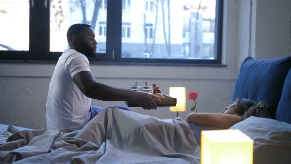 Man Bringing His Beloved Woman Breakfast in Bed