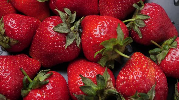 A Lot of Red and Ripe Strawberries Rotating