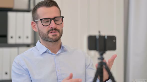 Middle Aged Man Recording Video on Smartphone