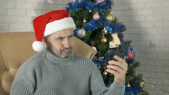 Alone Man Chatting in Christmas Home