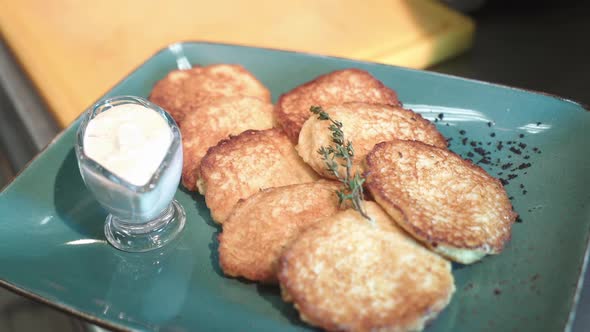 Potato pancakes fried, full of garlic, herbs