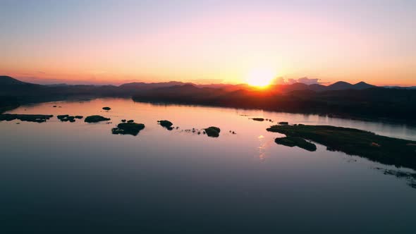 4K flying a drone over a river and wetland area