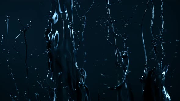 Super Slow Motion Shot of Glossy Dark Blue Paint Splash at 1000 Fps