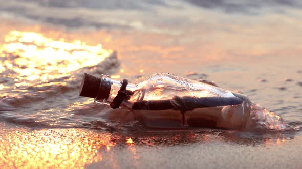 Message in the Bottle Against the Sun Setting Down