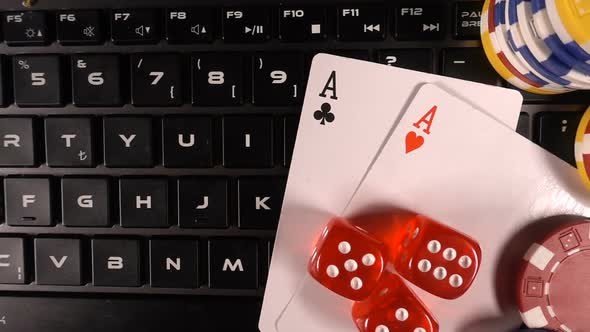 Gambling Money Chips Poker Cards And Dices On Laptop Computer 3 alt