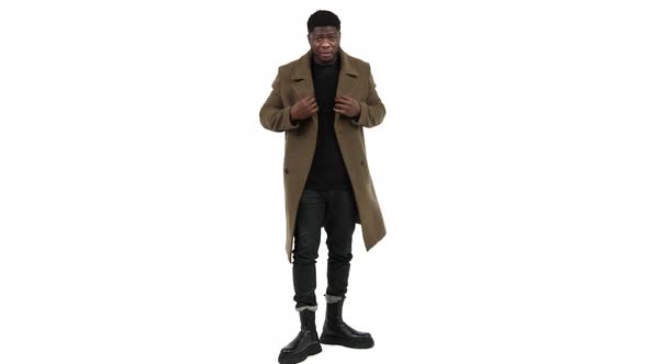 Serious Black Man Modeling Brown Coat White Background  Full Shot Isolated