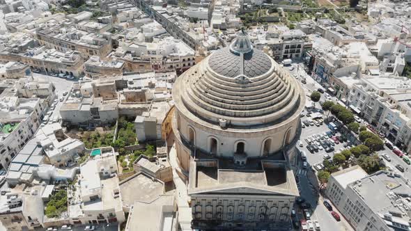 A wide view, aerial 4k drone footage, circling the Mosta Rotunda Dome - Mosta, Malta