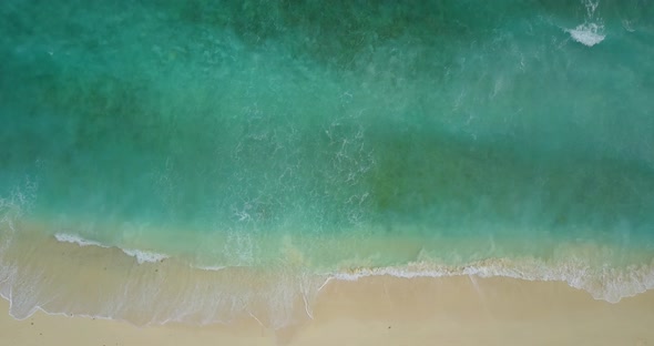 Beautiful drone clean view of a white sand paradise beach and aqua blue water background in colourfu
