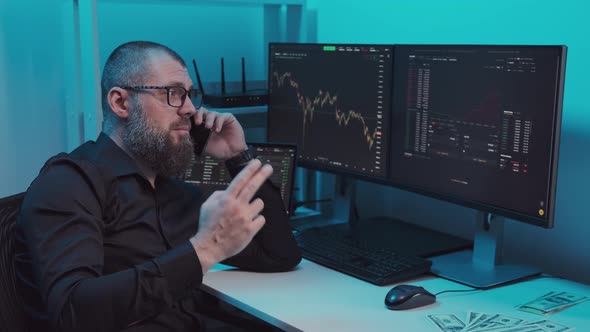 Stock Broker or Trader Talking Animatedly on the Phone