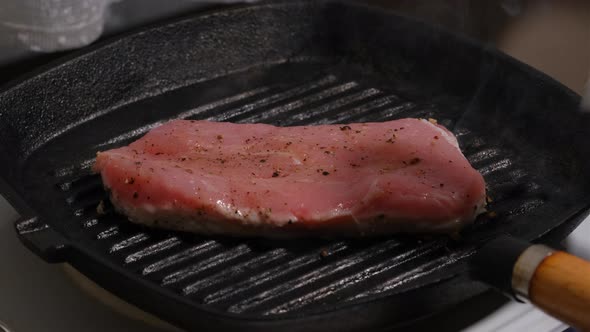 Turning Pork Chops On Frying Pan