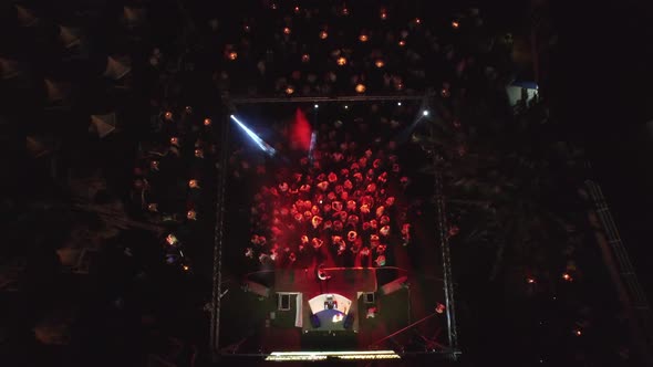 Crowded People Dancing at Disco Music Concert in Open-Air Summer Night Club Party