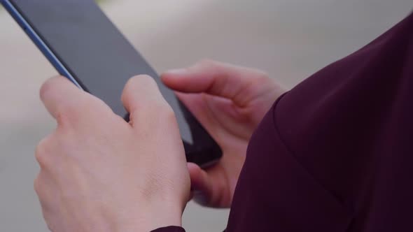 Woman typing online message using mobile phone smartphone.