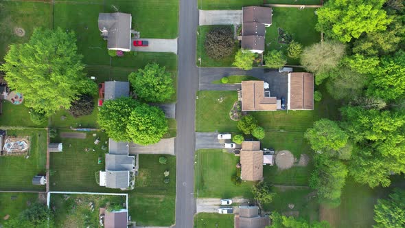 Top Down drone view of American suburban neighborhood. Establishing shot of America's suburb, street