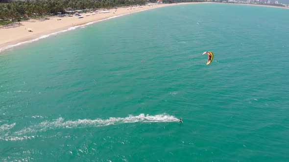 Extreme Water Sport and Summer Vacations Concept. Professional Kite Surfer on the Sea Wave, Athlete