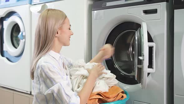 Washing Machine Washes Dirty Laundry Woman Takes Clean Laundry Out of Washing Machine Public