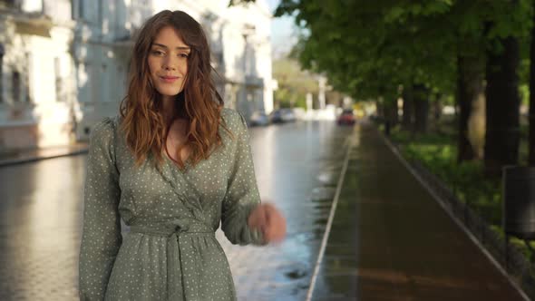 Portrait of Adorable Young Woman 20s Wearing Beautiful Summer Dress Smiling While Walking Through