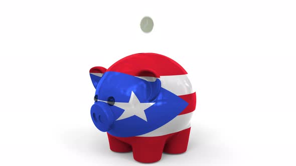 Coins Fall Into Piggy Bank Painted with Flag of Puerto Rico