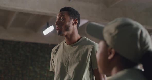 Black Soldier Speaking with Squadmates