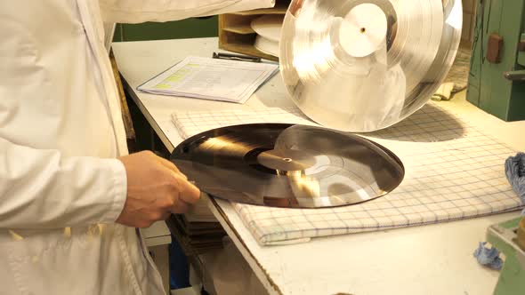 Removing metal layer from the lacquer creating a metal stamper to press from